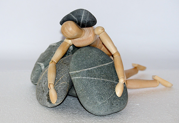 A Manikin that has collapsed under the weight of some pebbles