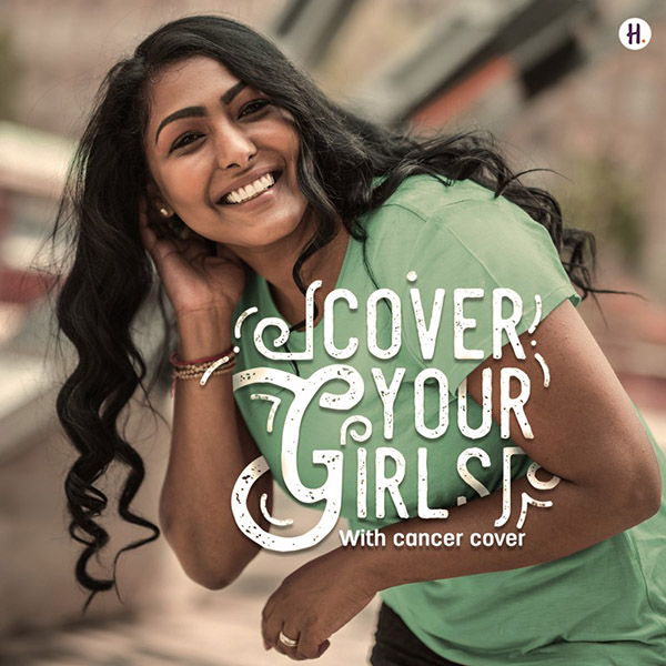 Young woman wearing a green T-shirt smiling. Foreground copy reading "Cover your girls with Cancer Cover".