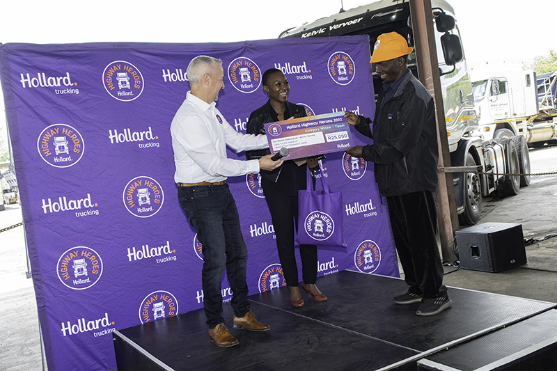 Tori Martin Ramokgadi being handed his award on stage.