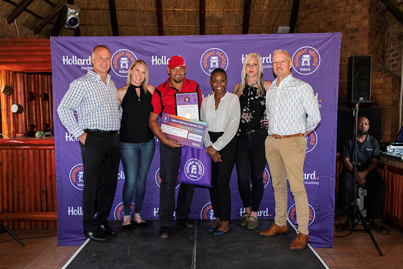 Pieter Fredericks, Hollard Highway Heroes winner of the Tautliners category posing in a group with his award.