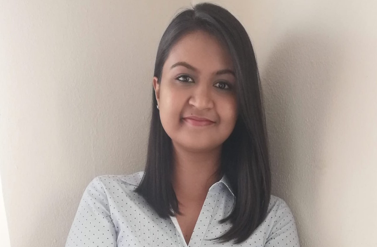 A portrait photograph of Arisha Maharajh, Hollard’s first female risk consultant.