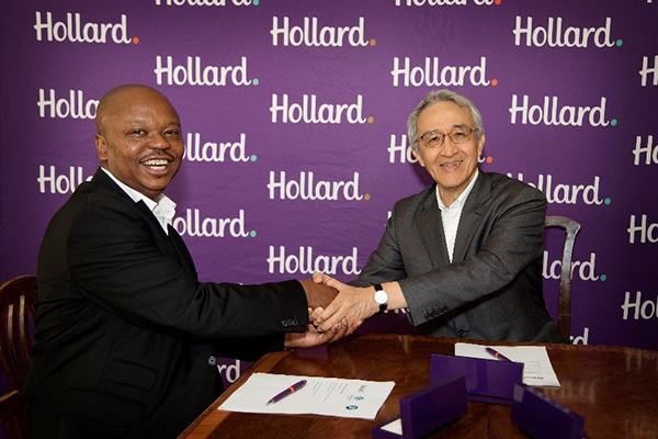 Hollard Group CEO Saks Ntombela shaking hands with Tsuyoshi Nagano, President and Group CEO of Tokio Marine at Hollard's premises in Johannesburg.
