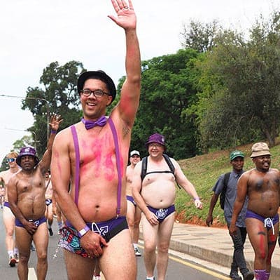 Participant waving during the Hollard Daredevil Run 2025