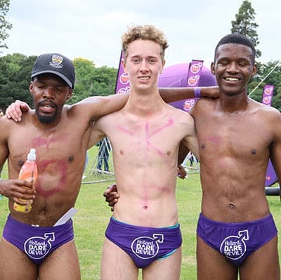 Three participants posing at the Hollard Daredevil Run 2025