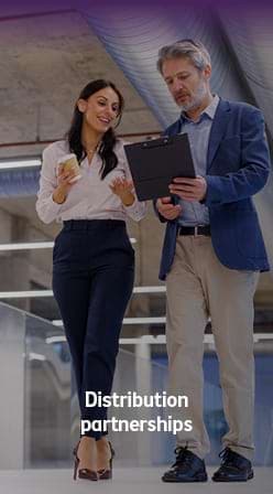 Business professionals reviewing information, illustrating a distribution partnership.