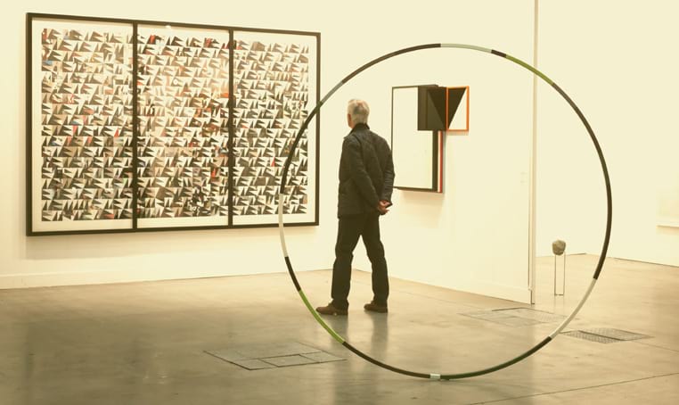 photo of man in a gallery insured by IToo Artinsure
