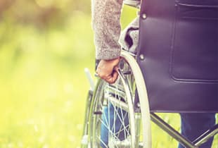 A pair of crutches leaning against the wall, symbolising Hollard Personal Accident Cover
