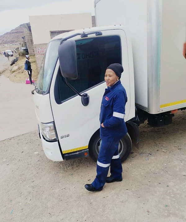 Highway Hero, Nonkoliso Jineneka, standing by her truck