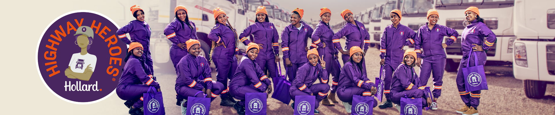 Hollard Highway Heroes Women In Transport group in purple overalls by trucks