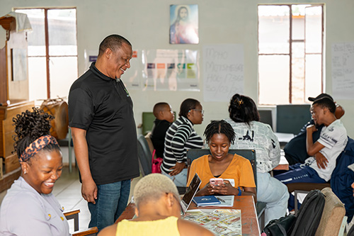 Students sitting at the table in the classroom for the Hollard Streetwise FInance Rural SMME project