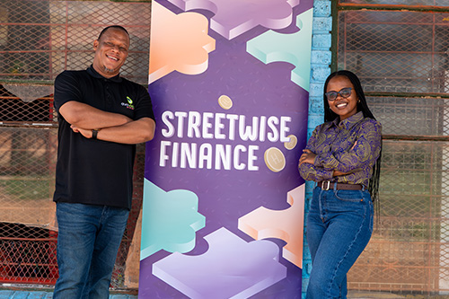 Streetwise Finance team posing with the banner for the Rural SMME project