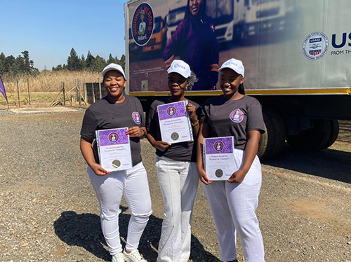 Three WIWIT participants pose with their certificates