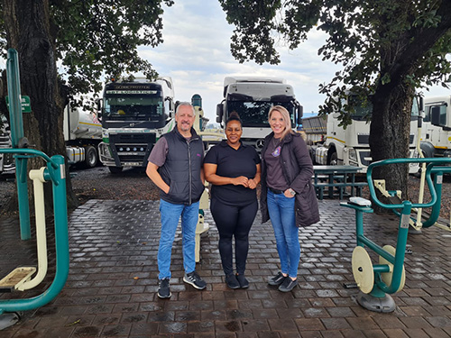 3 Hollard Trucking representatives standing at the Kuhle Eatery at Middelburg N4 Truck Stop, Mpumalanga