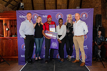 Pieter Friedericks with the Hollard team, holding his Highway Heroes award