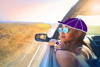 Hollard Disability Cover client happily travelling in a vehicle.